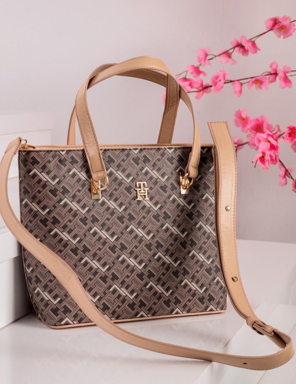 شنطة يد حريمي تومي