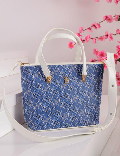 شنطة يد حريمي تومي