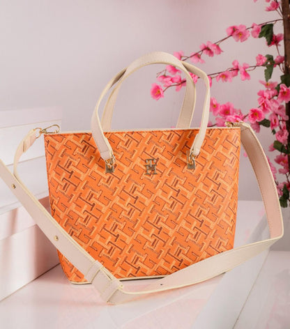 شنطة يد حريمي تومي