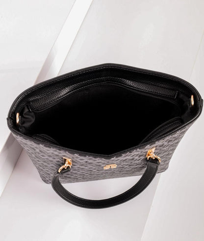 شنطة يد حريمي تومي